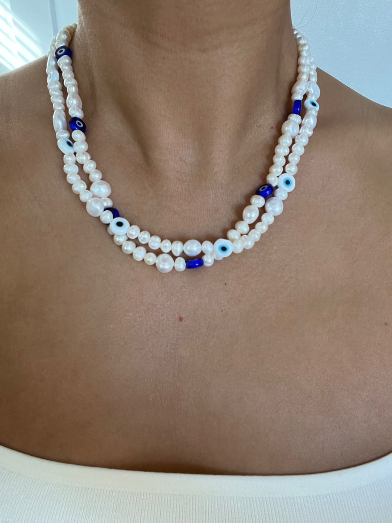 Pearl necklace with evil eye deals